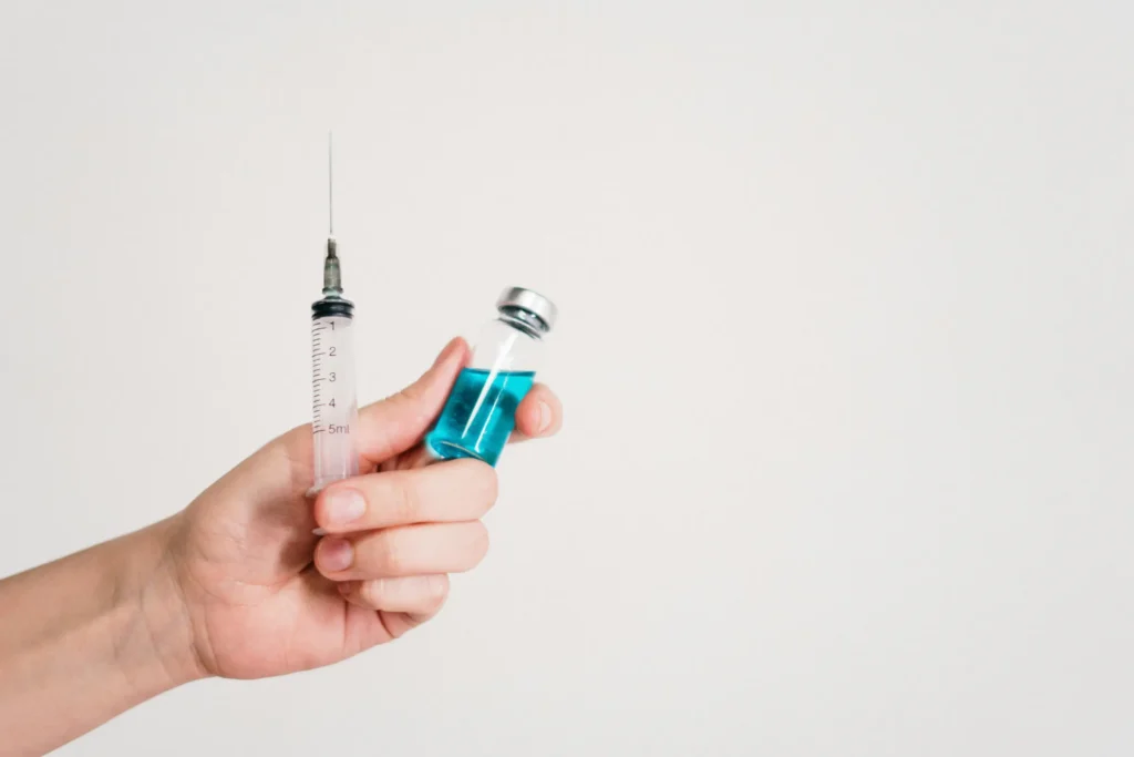 Vaccine and syringe