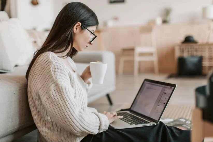 a girls searching on internet using her laptop