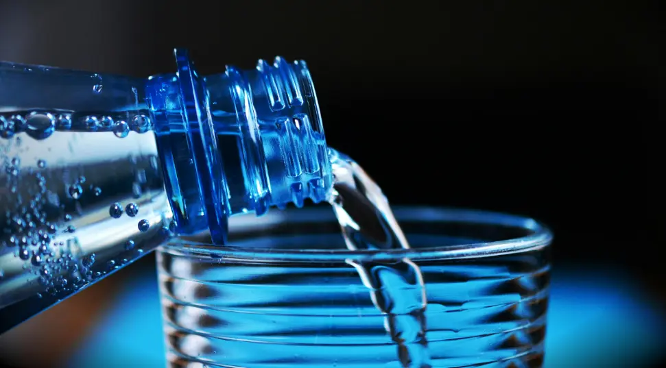 water bottle pouring water in the glass